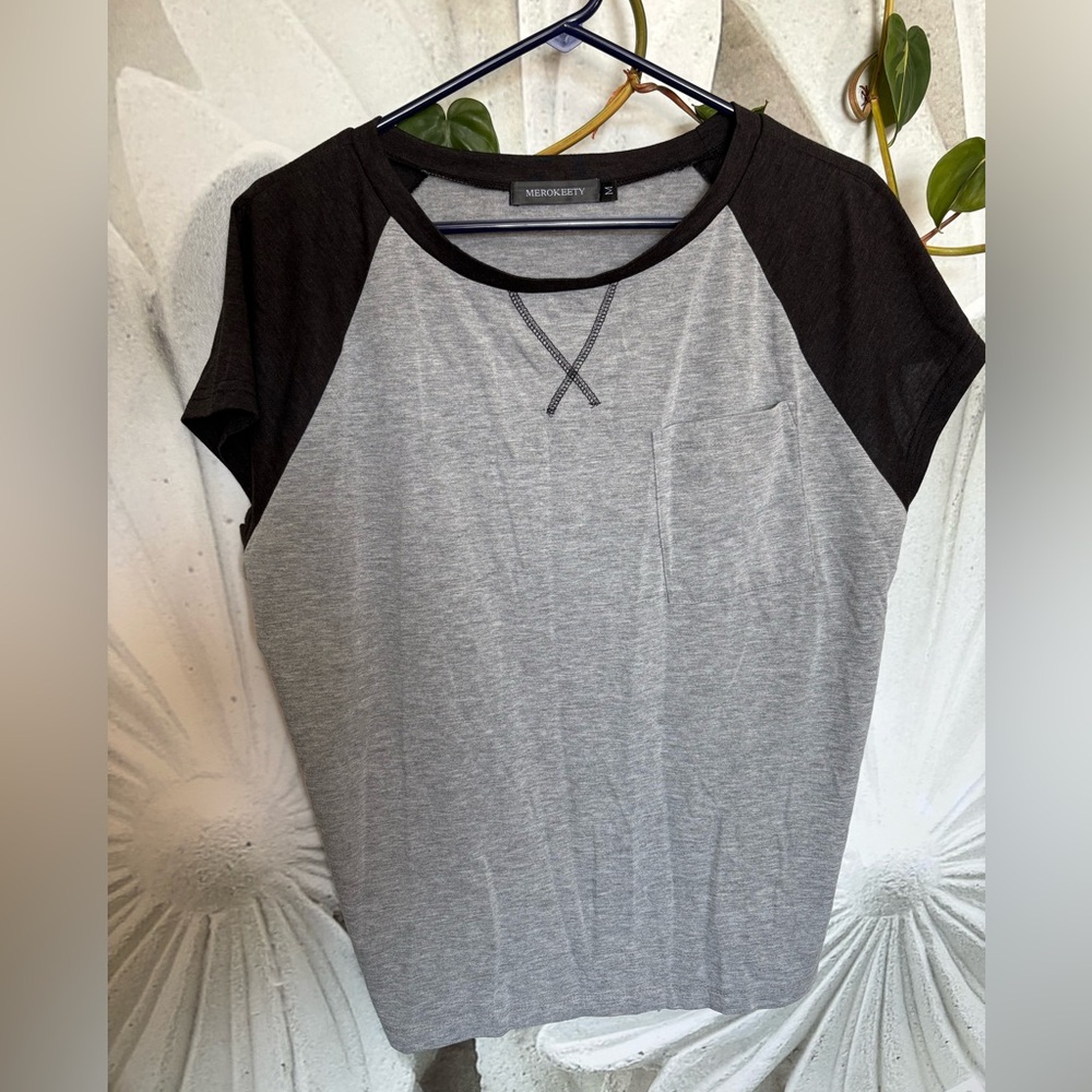 Black and grey womens t-shirt. Size medium. smoke free home.